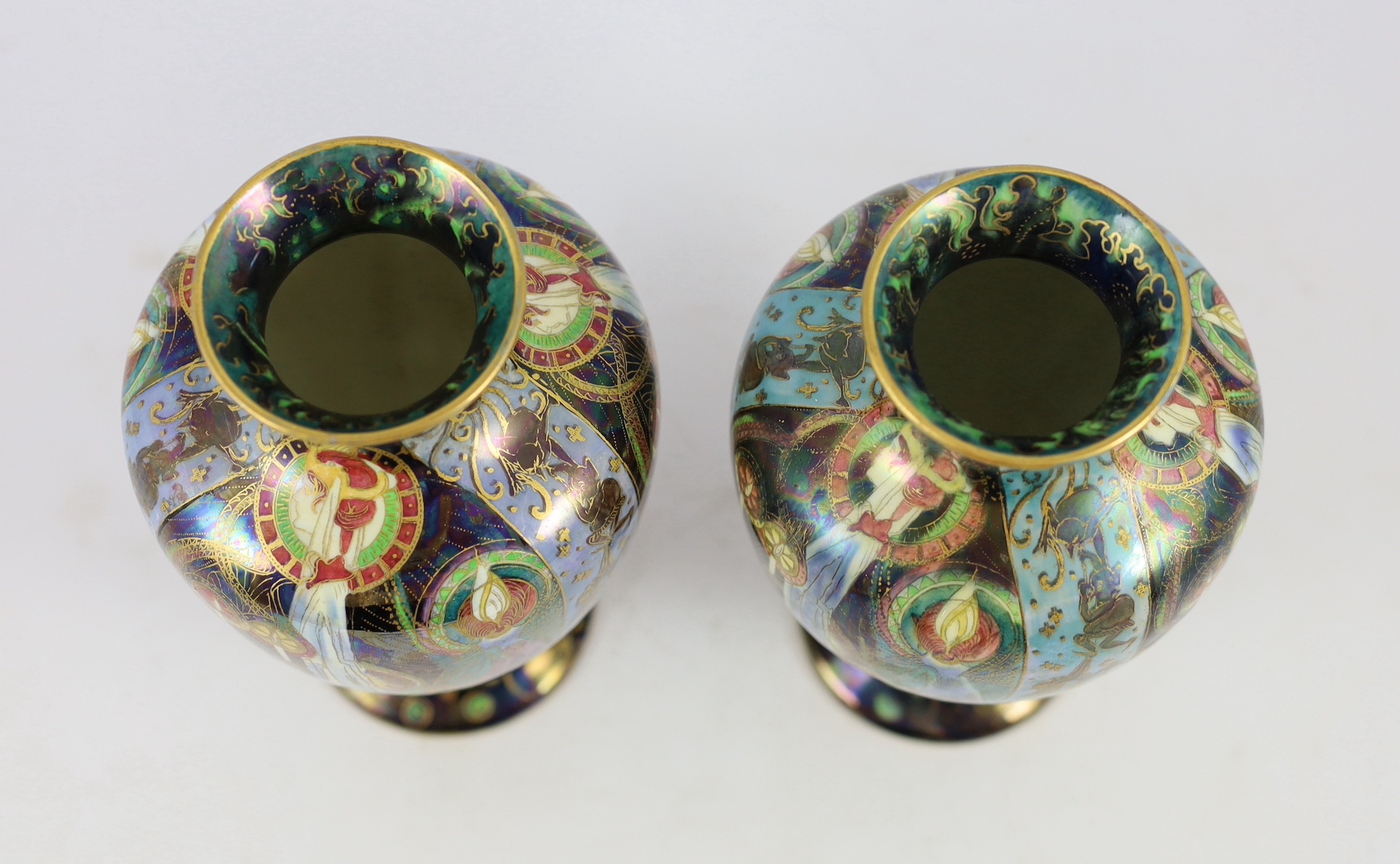 N.B. RESTORATION TO ONE VASE A pair of Wedgwood ’Candlemas’ Fairyland lustre vases, designed by Daisy Makeig-Jones, 21.5cm high